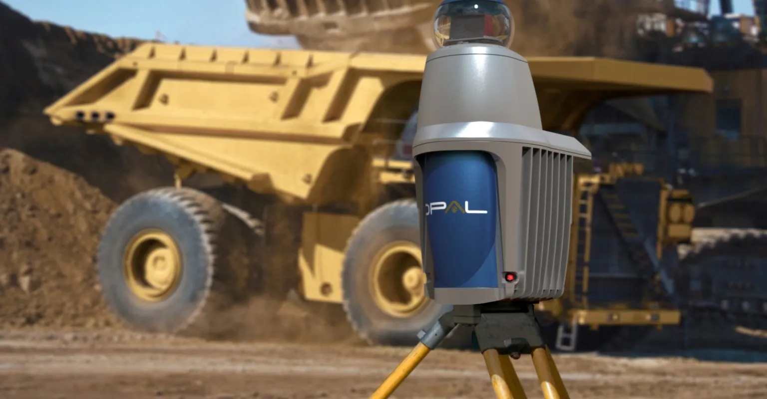Neptec OPAL LiDAR sensor on a tripod in front of a mining haul truck